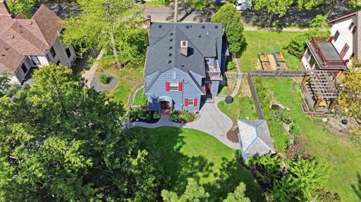 Fully fenced backyard, a custom patio, built-in grill, and a separate screened âsummer houseâ