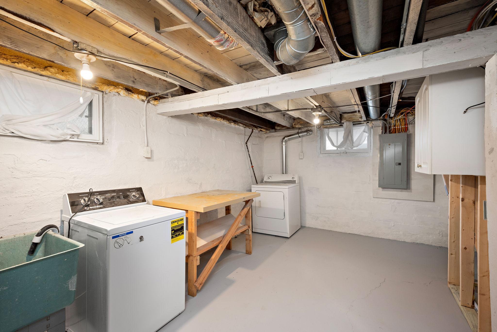 Large laundry and utility room. Would be great potential craft or workshop space!