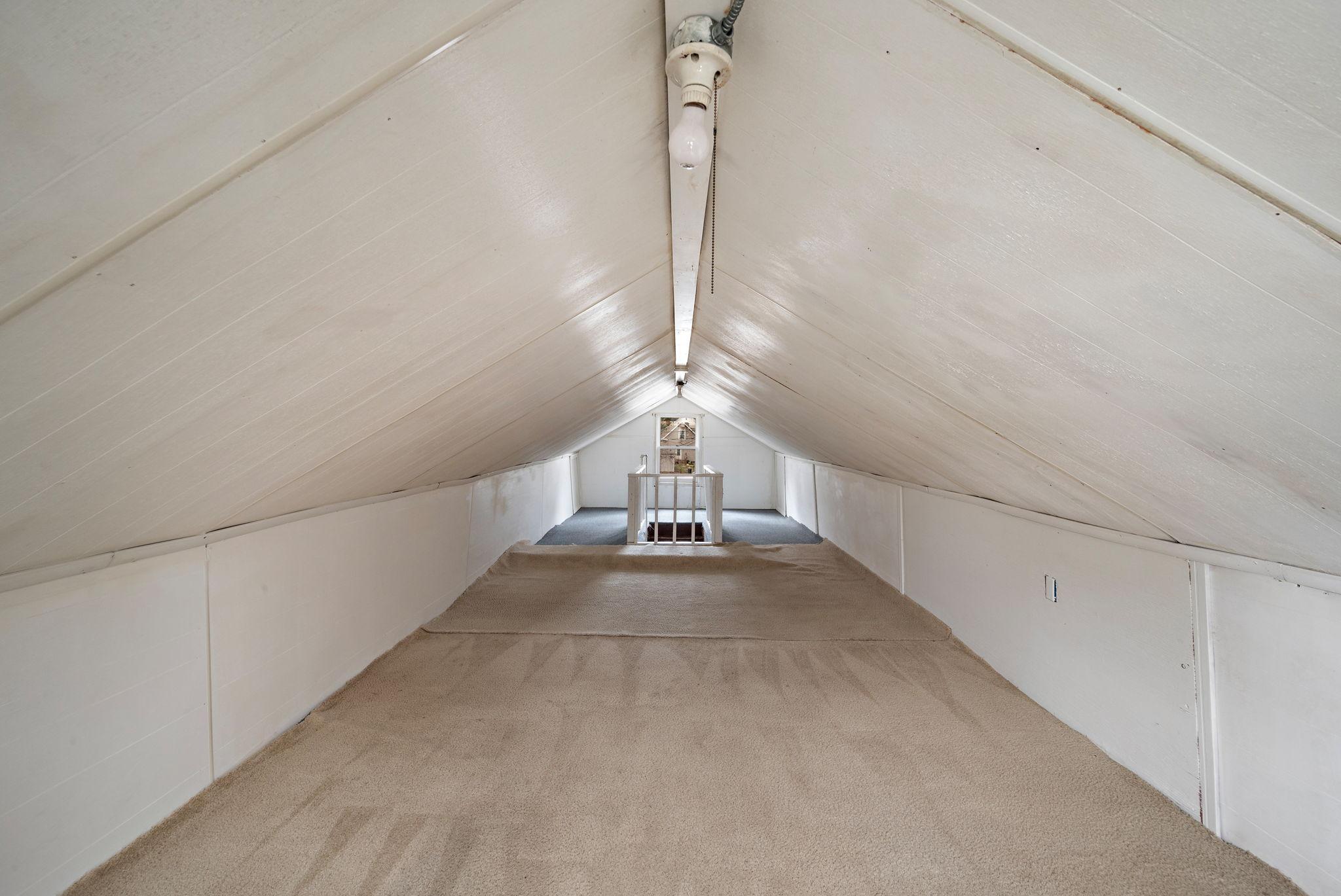 Upper level expansion is finished, but has low headroom. Open to multiple uses.