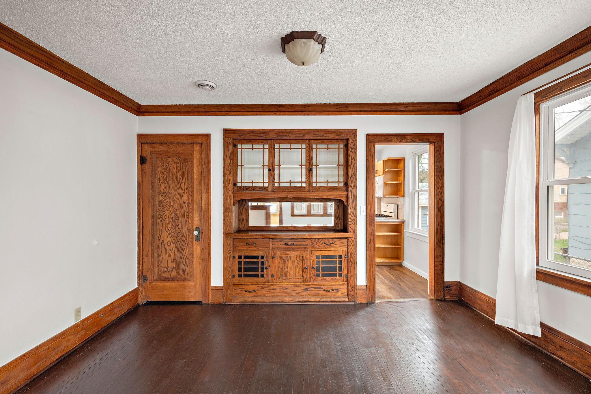 Dining room has a beautiful built-in and door to expansion room.