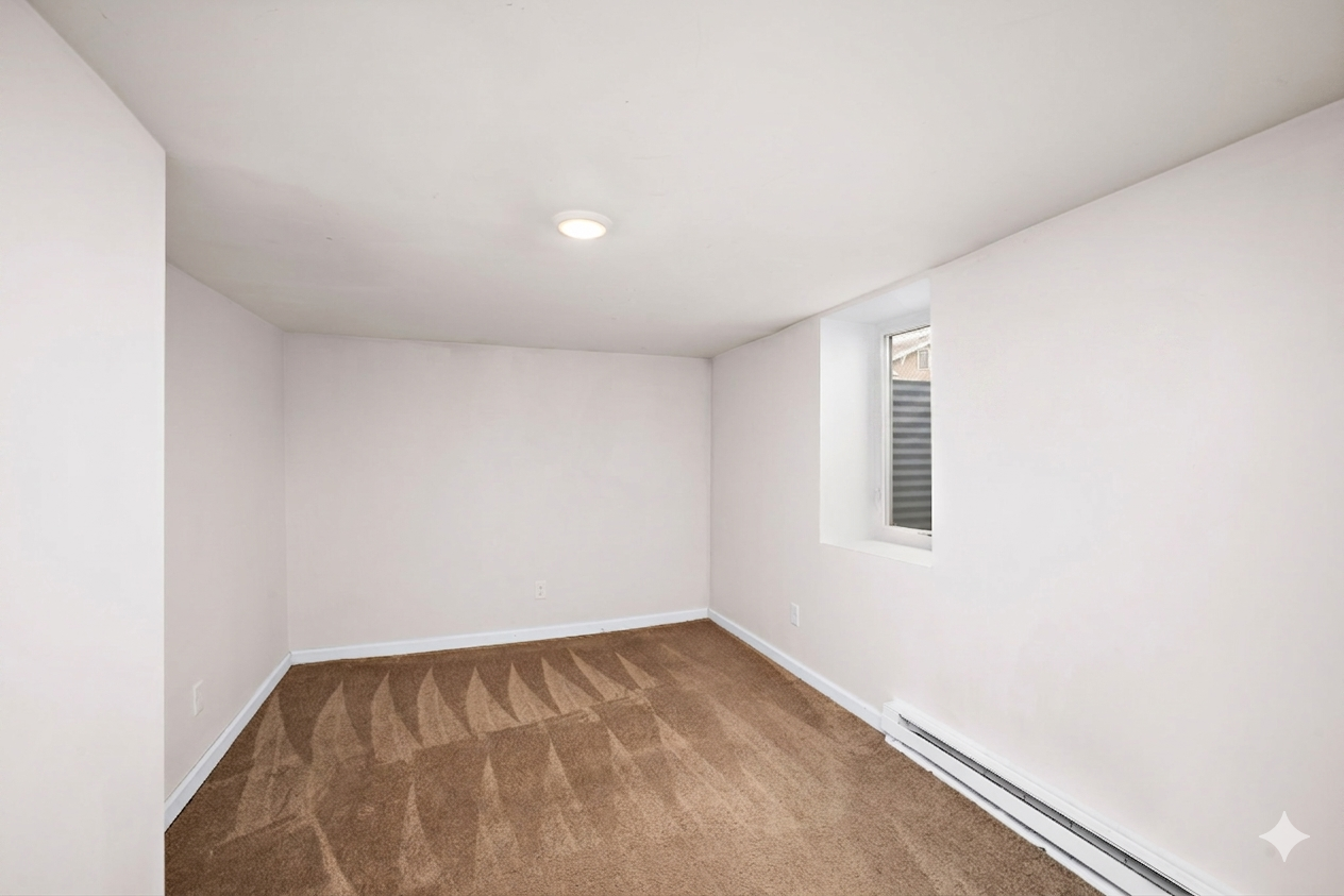 Lower level bedroom with egress window