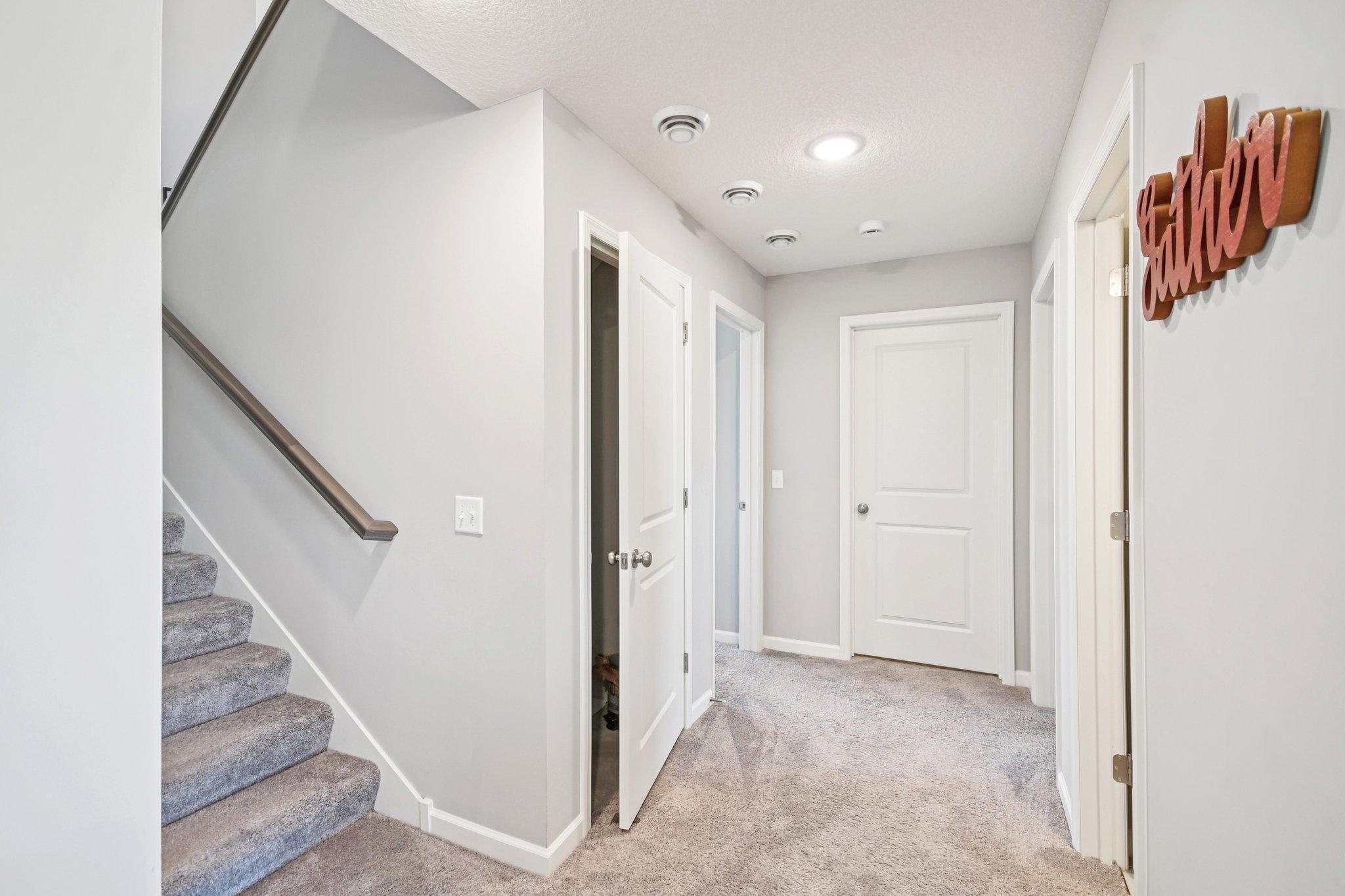 Basement Hallway Leading to Bedrooms & Laundry