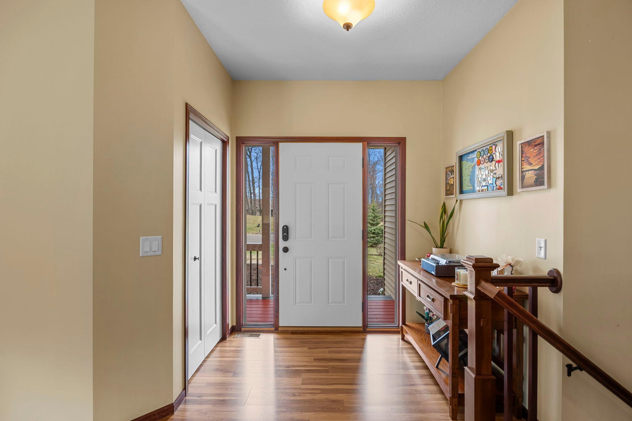Bright foyer with coat closet