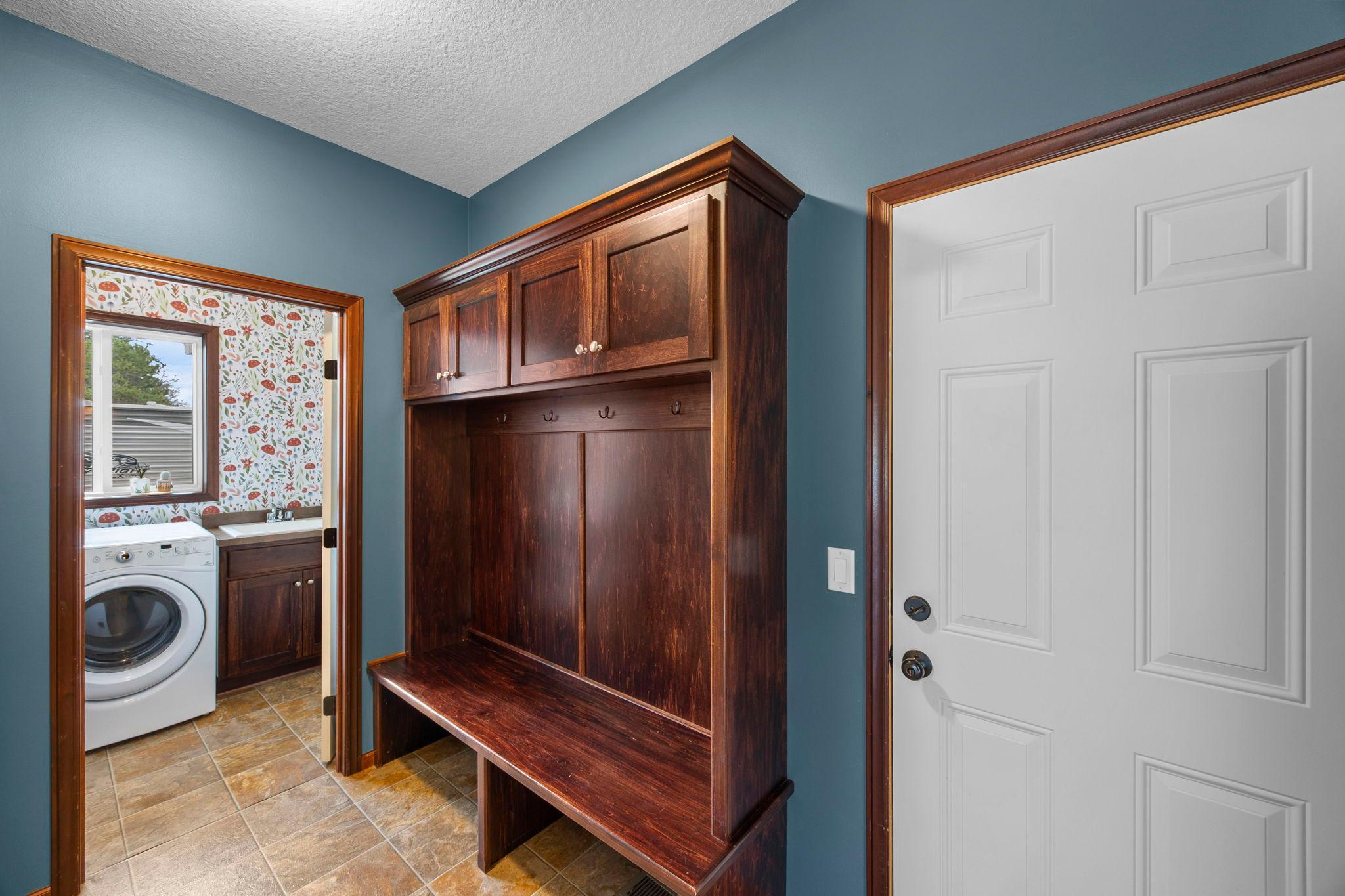 Smart floorplan - mud room between garage entrance and laundry