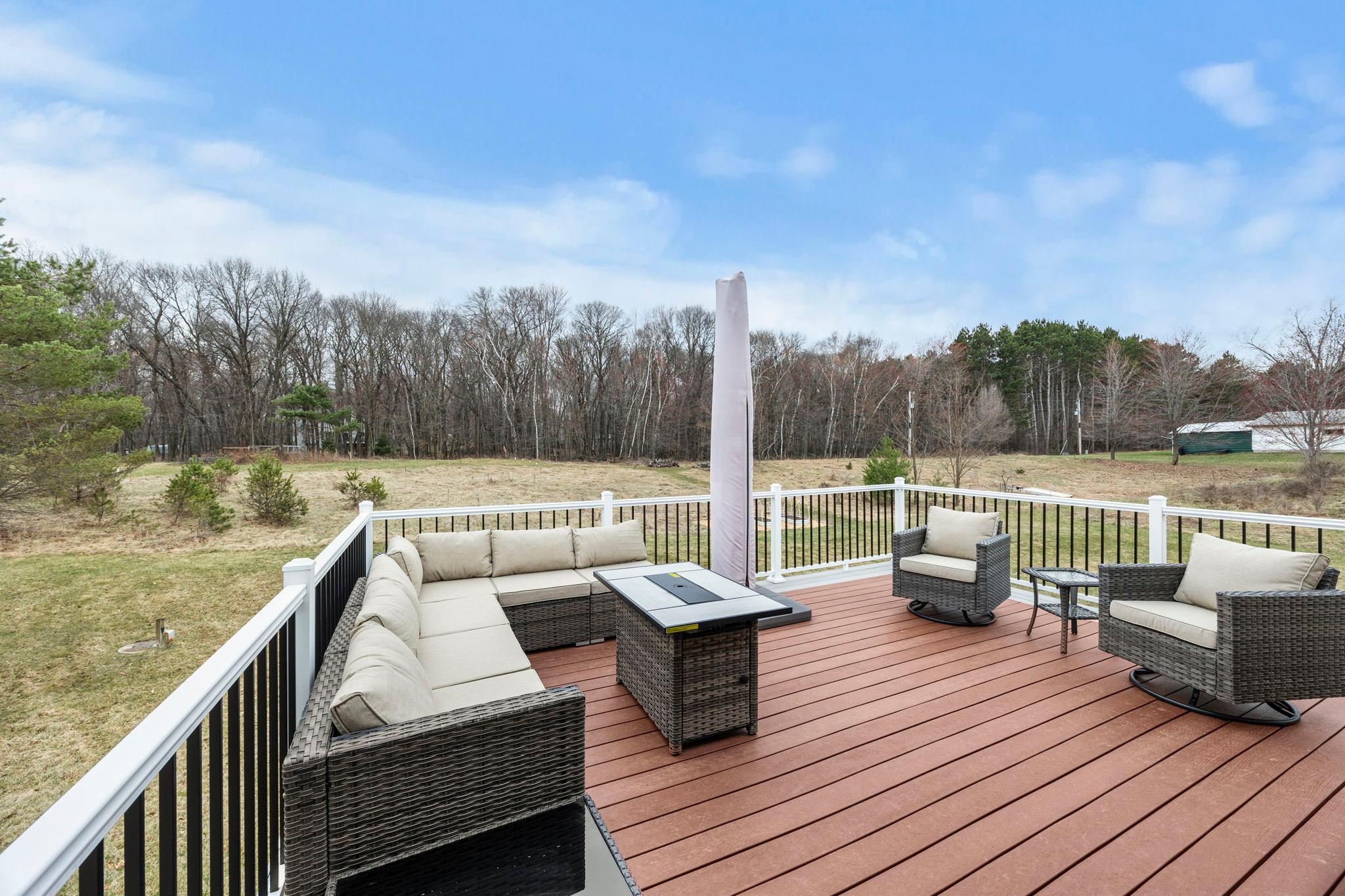 Maintenance-free composite deck overlooking your grove of trees