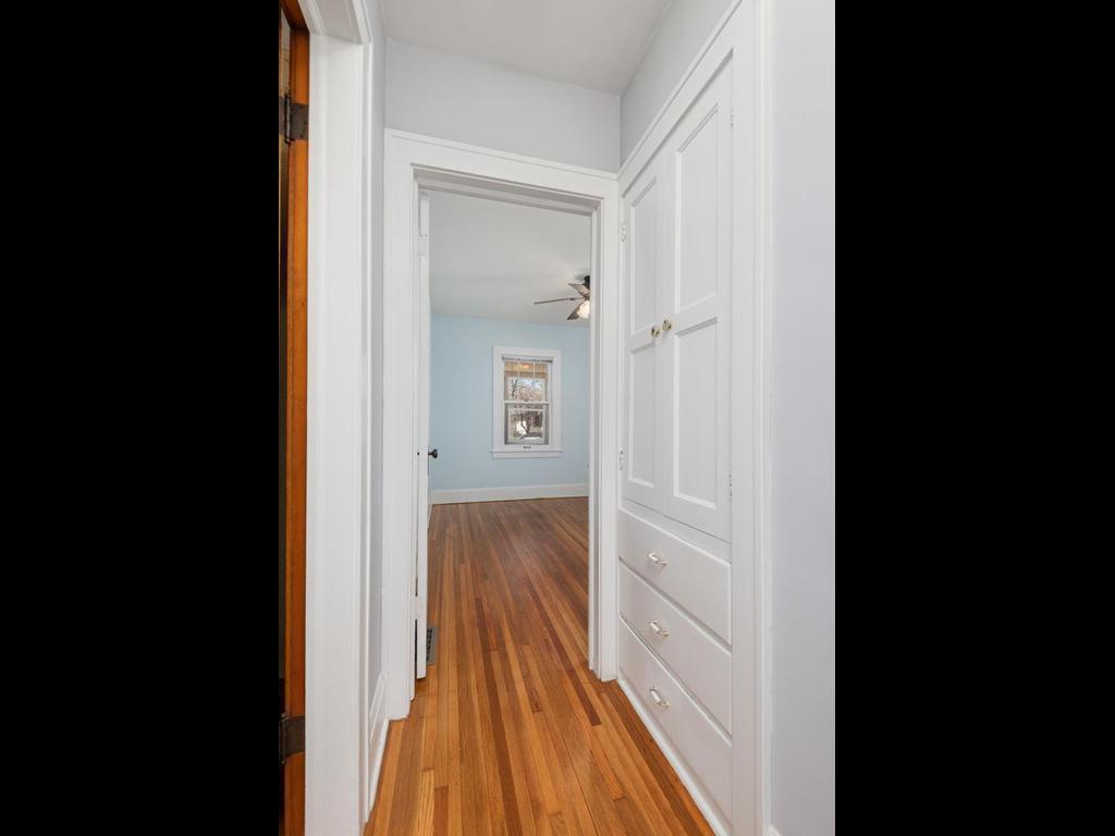 Another unique time-period feature is the custom built-in nestled in the hallway.
