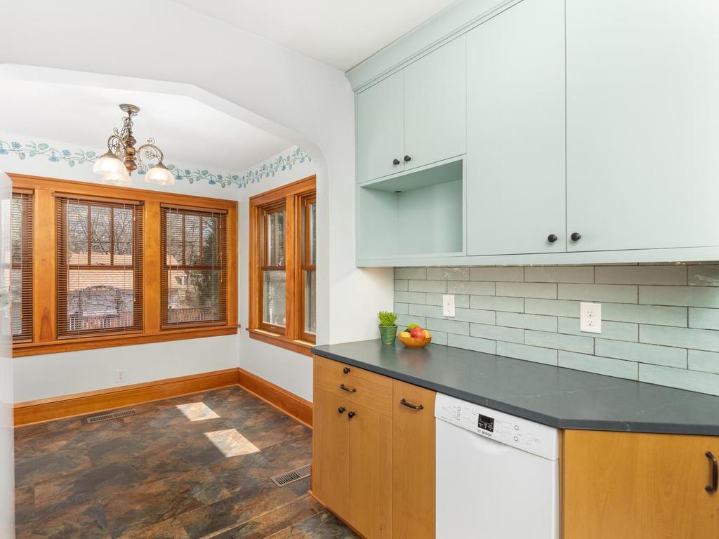 The Kitchen opens into the Sunroom.