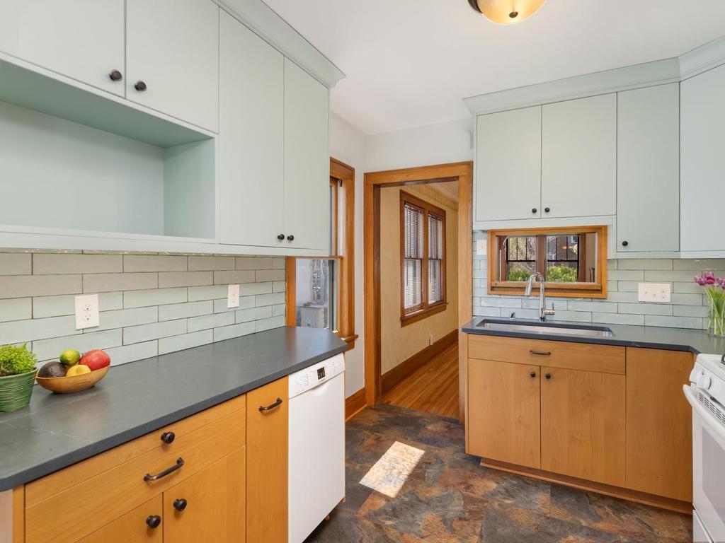 The remodeled Kitchen (2020) showcases two-tone uppers and lowers to add character, solid-surface countertop with under-mount stainless steel sink for great workspace and meal prep!