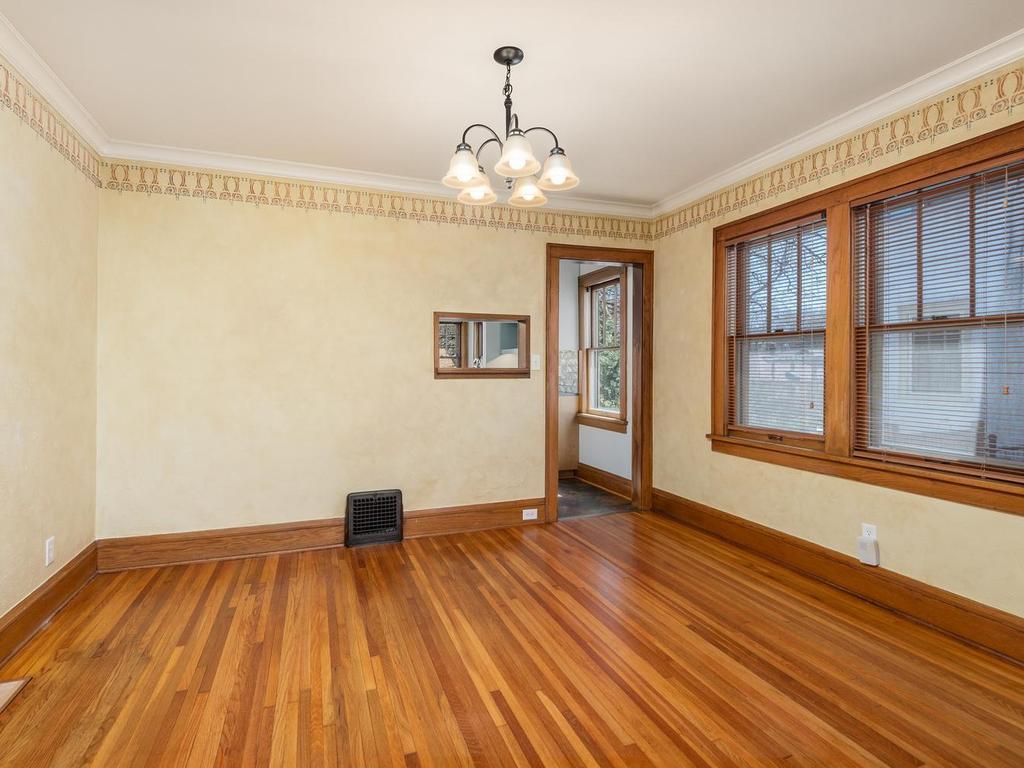 Dining Room features a hand-stenciled border and has a pass-through window into the Kitchen.