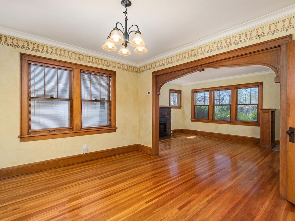 The hardwood floor flows naturally from the Living Room into the Dining Room for a seamless transition.