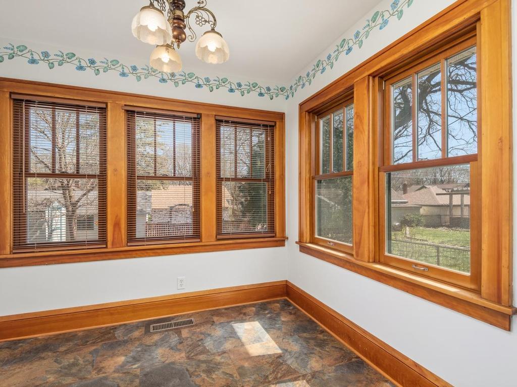 The Sunroom features hand-stenciled border and could easily be set-up as your breakfast dining area to enjoy the views of the backyard through the changing seasons.