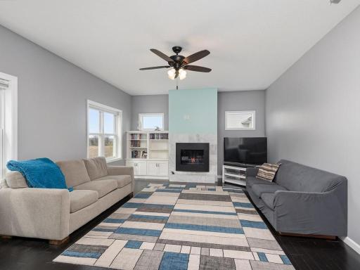 Spacious Living Room with gas fireplace & custom built-ins.