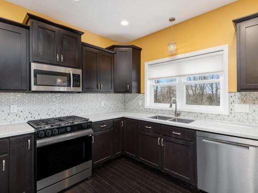 The tiled backsplash provides a hint of sparkle to this space!