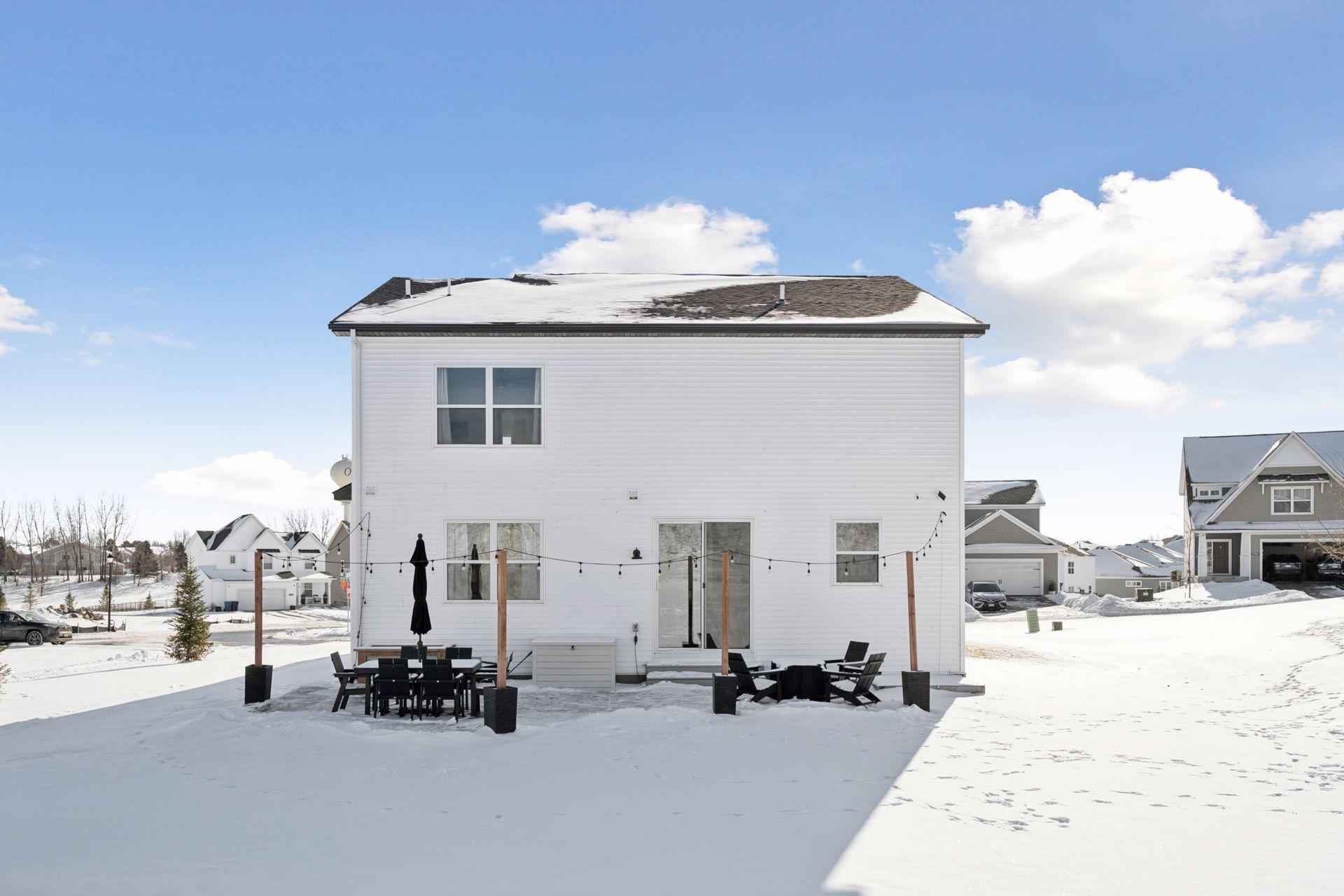 Back patio with planter and string lighting perfect for those summer and fall nights.