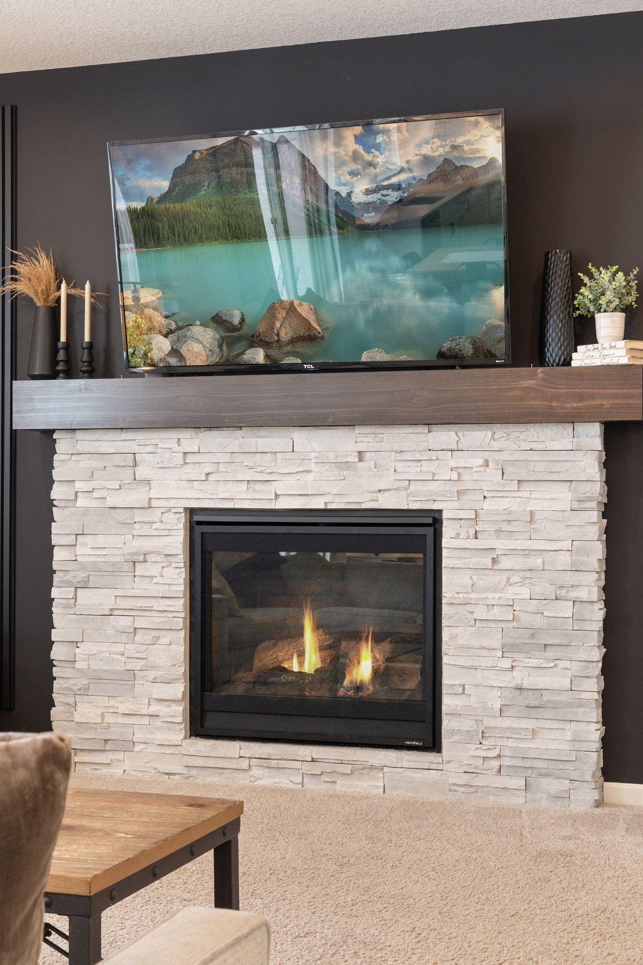 Recently refinished fireplace wall with cohesive finishes to match the rest of the home.