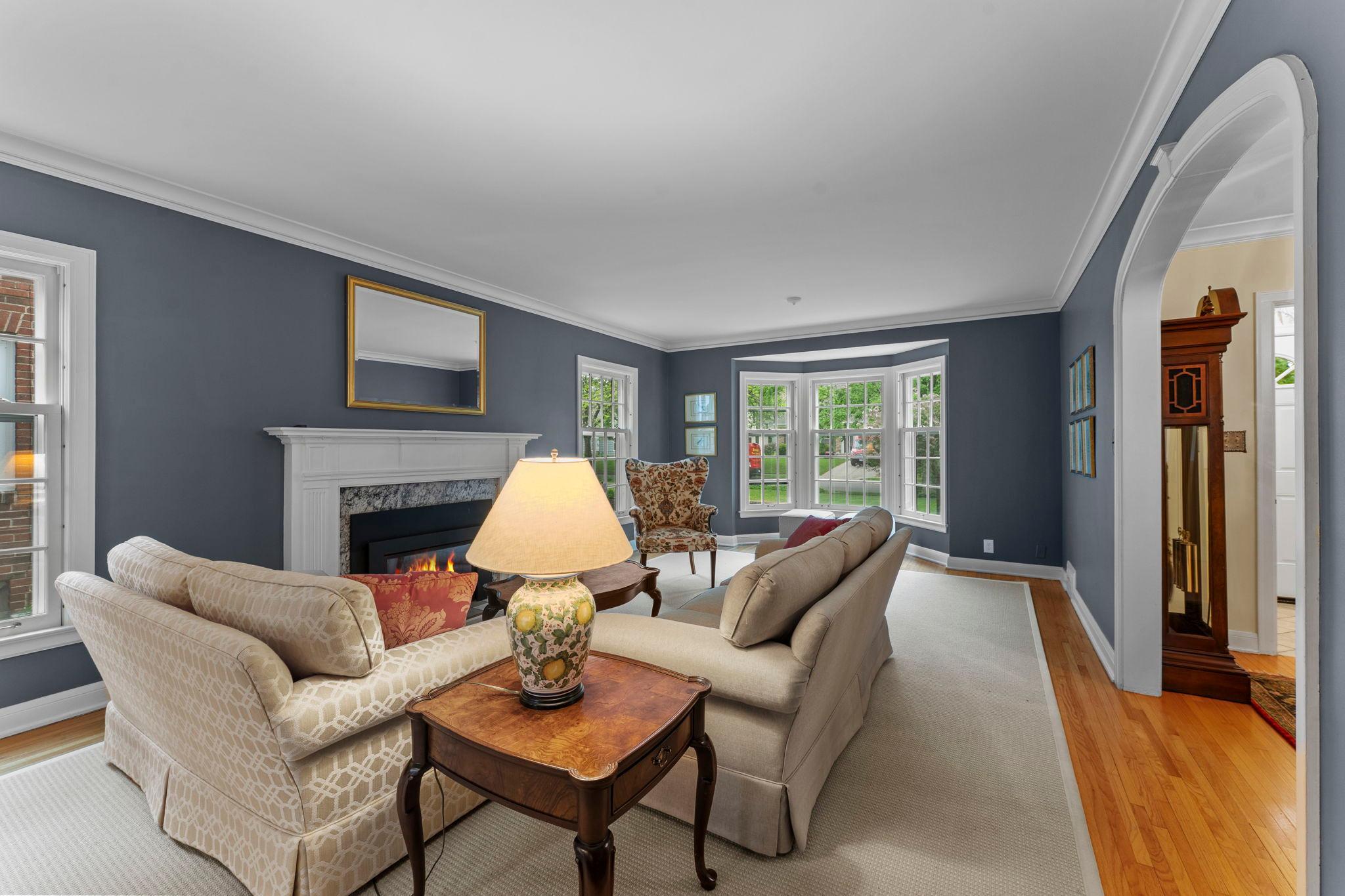 Large living room with front bay window
