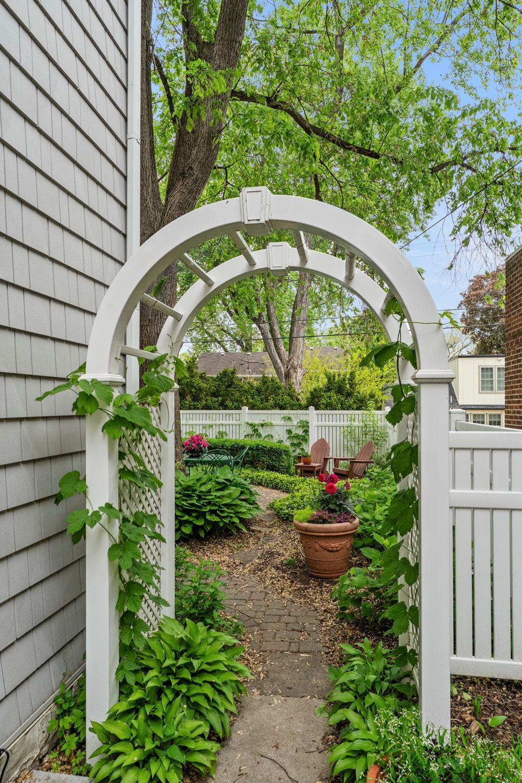 Archway to private backyard oasis