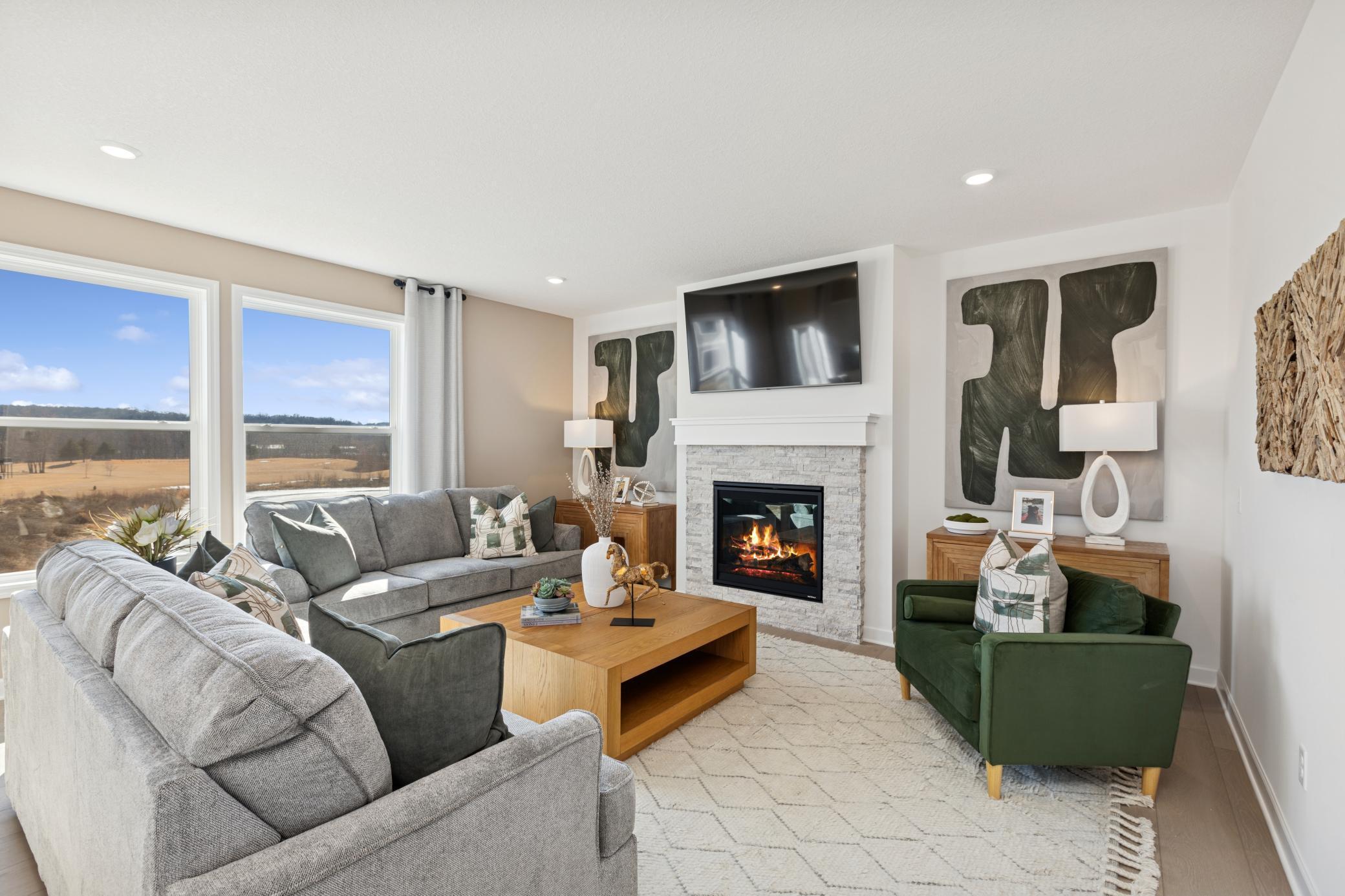 (Photo of Actual Model Home) The Great Room is a natural gathering space within the home where residents can curl up on the couch and enjoy a good book or movie with loved ones.