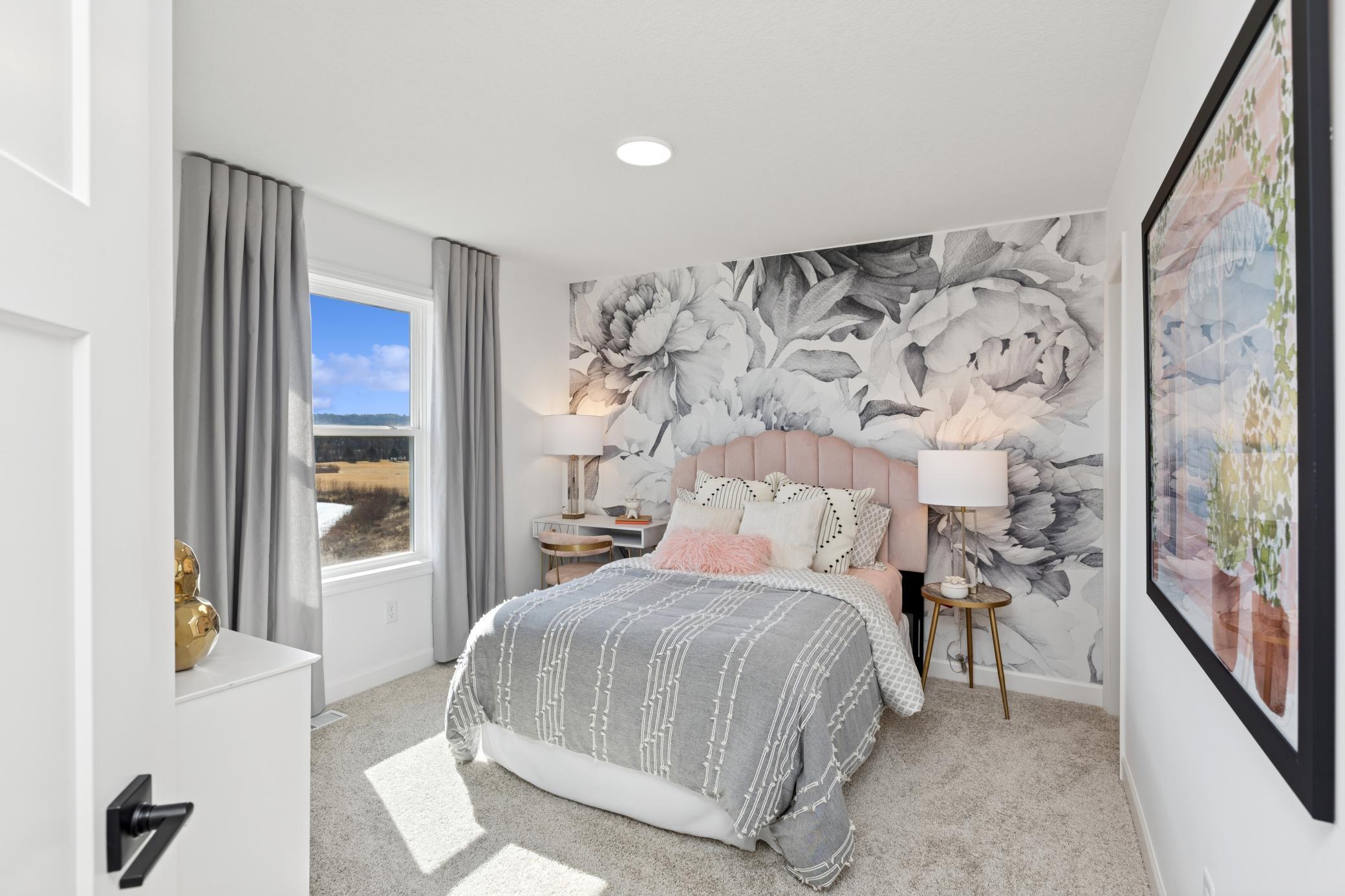 (Photo of Actual Model Home) Three secondary bedrooms are found upstairs, down the hall from the owner’s suite.