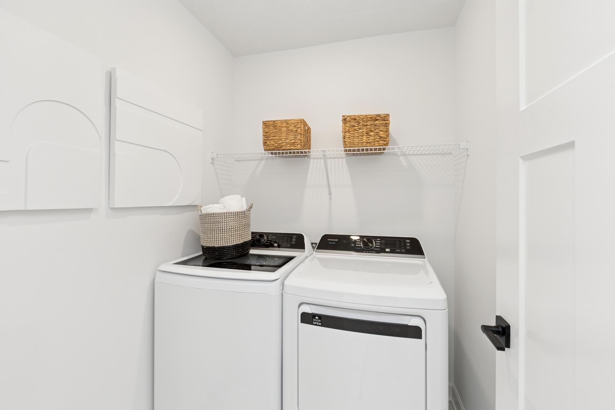 (Photo of Actual Model Home) Conveniently located upper level laundry!