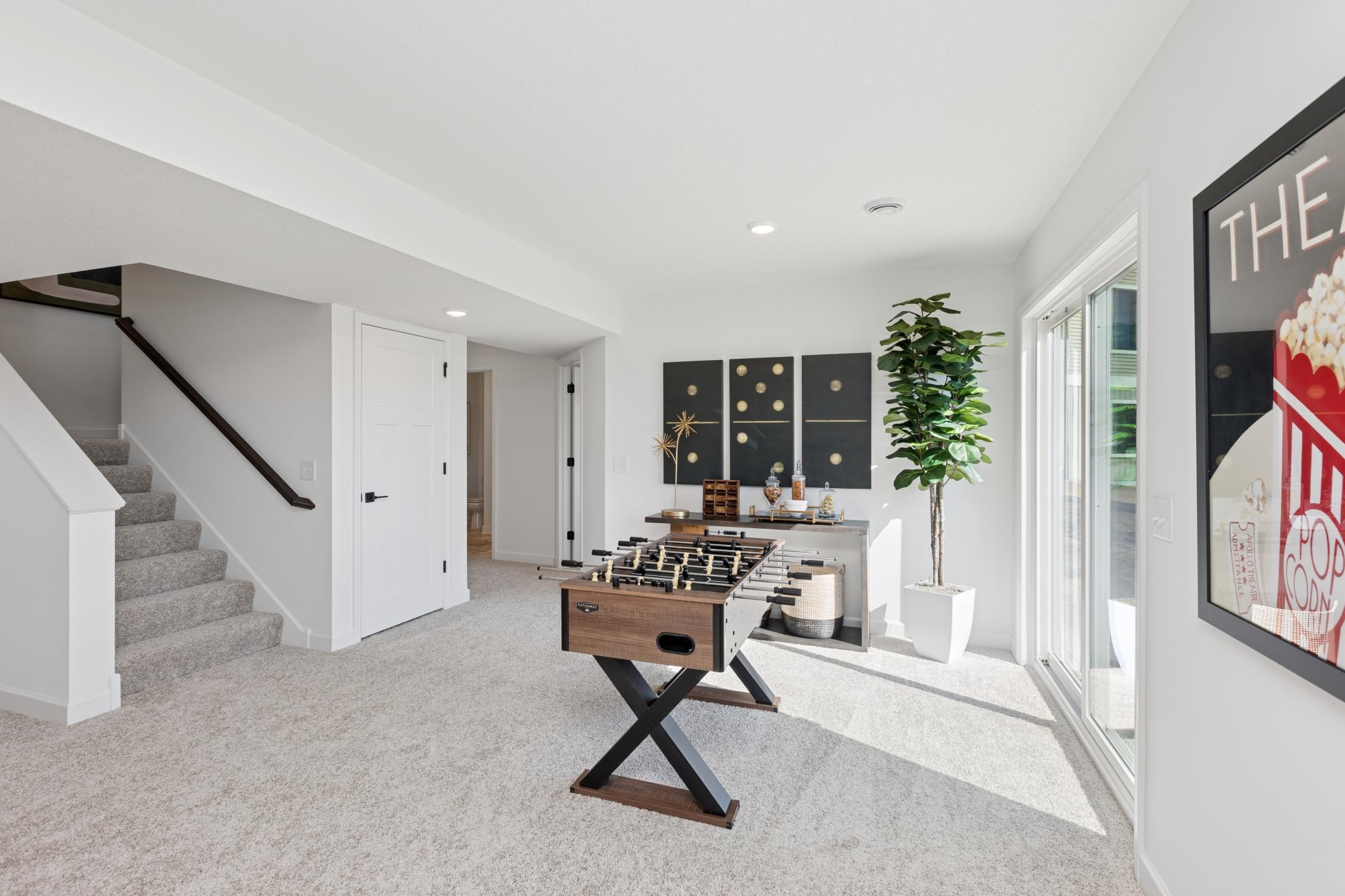 (Photo of Actual Model Home) A recreational area big enough for a pool table!