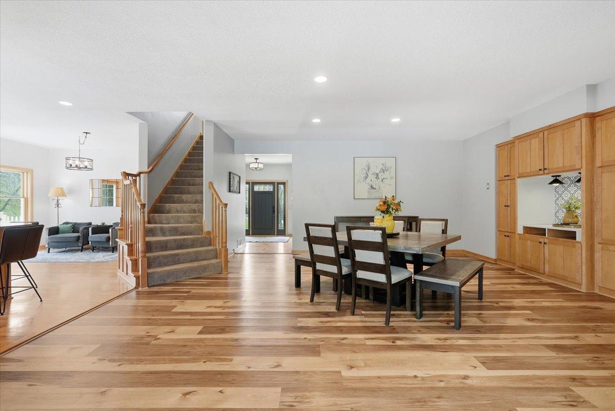This stunning dining room has it all, space, lighting, a gas burning fireplace and gorgeous built-ins for storage and decor