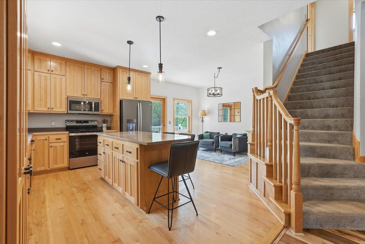 Spacious kitchen featuring new appliances and beautiful sitting area with buffet space for that morning coffee or tea
