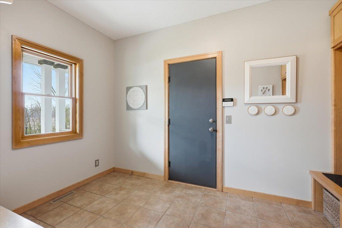 This large mudroom off the garage is great to drop shoes, jackets, bags, etc.
