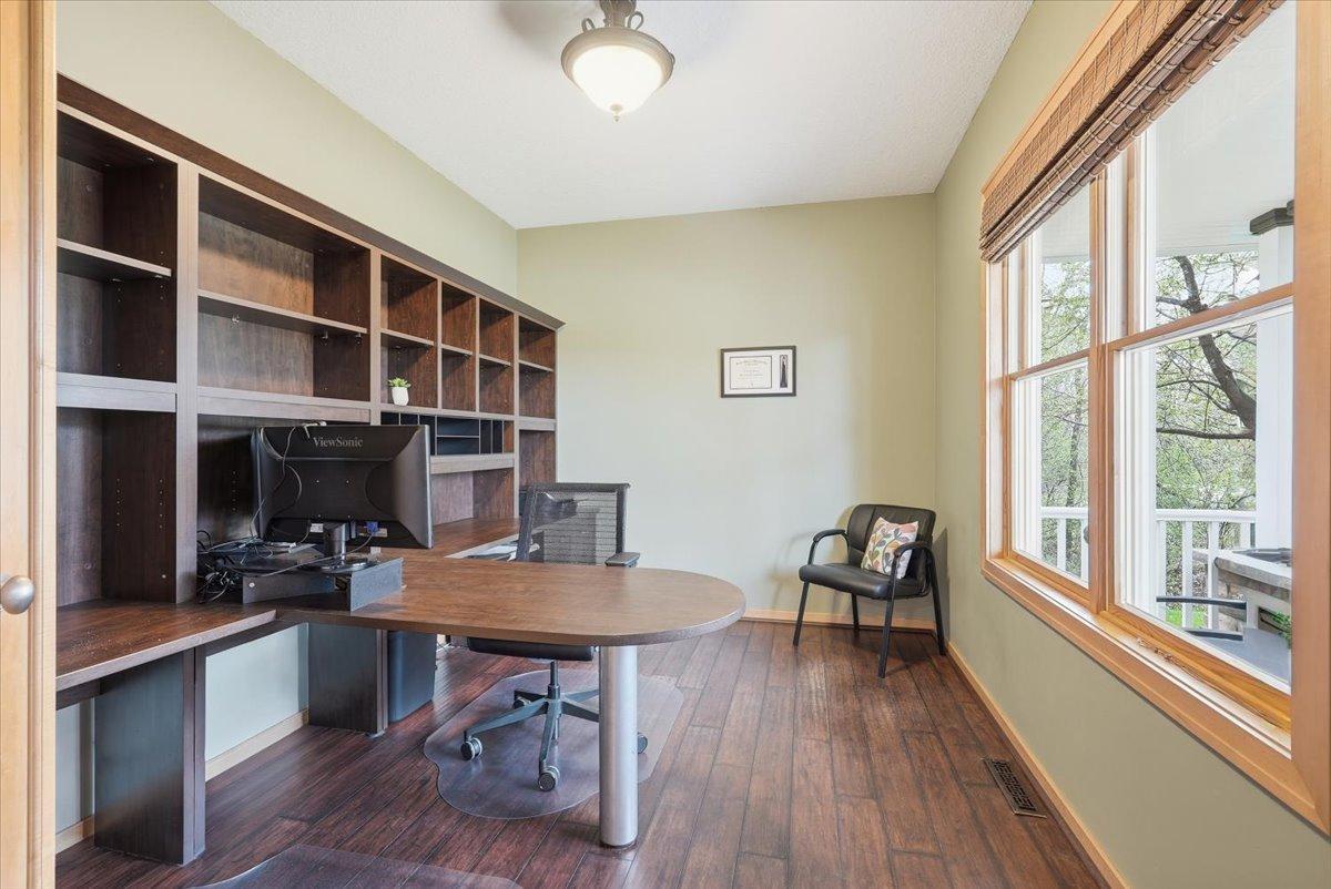 Beautiful office with views of the front porch and plenty of natural light