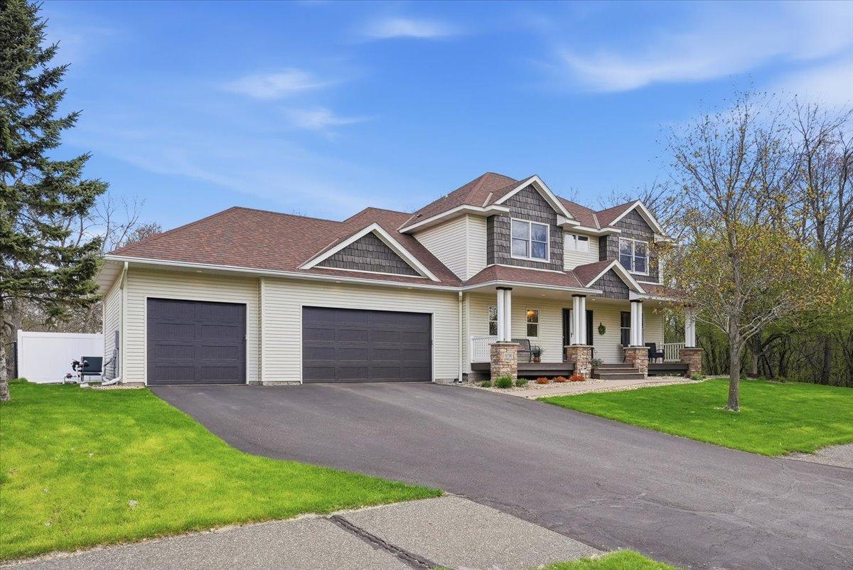 Ample driveway space leads up to insulated and heated, oversized 3 car garage