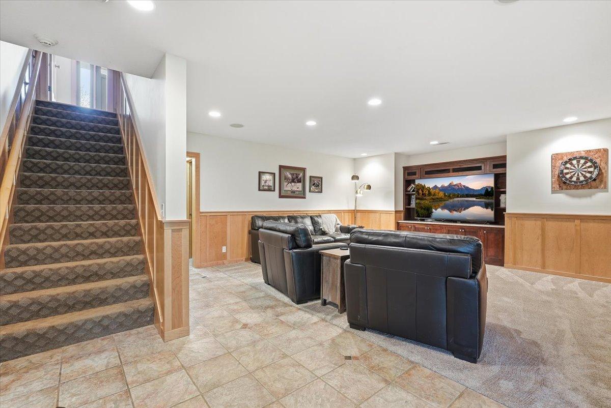 Large family room for entertaining, complete with heated tile floors and walk-out to backyard