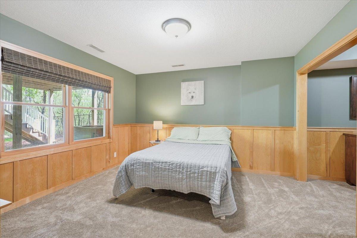 Lower level, bedroom 5, spacious with new flooring and large windows