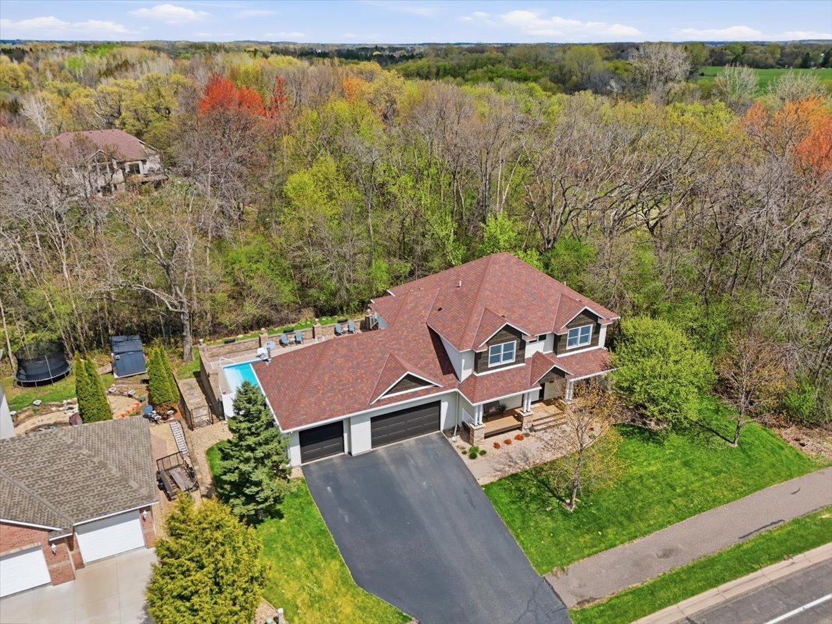 What a perfect position for this home with all of the living spaces showing the beautiful treeline and woods nearby.