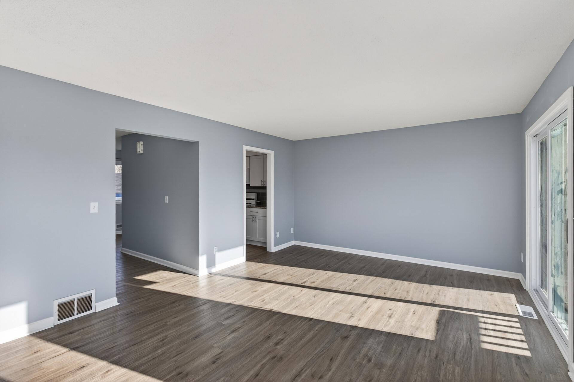 Spacious main living area with an open layout, generous natural light, and flexible space for everyday living or entertaining.