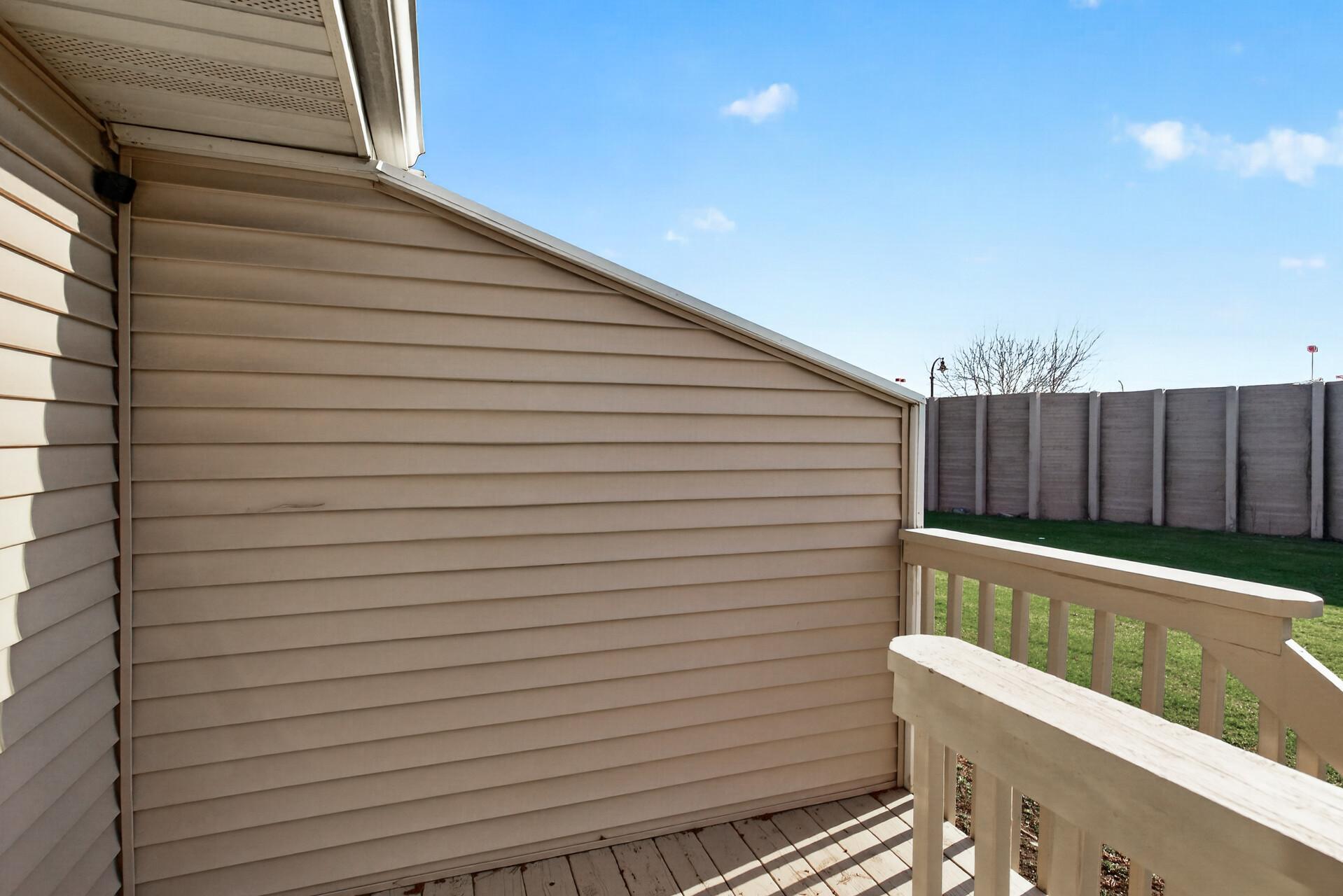 Private upper-level deck offering a peaceful outdoor retreat for morning coffee, grilling, or relaxing outdoors.