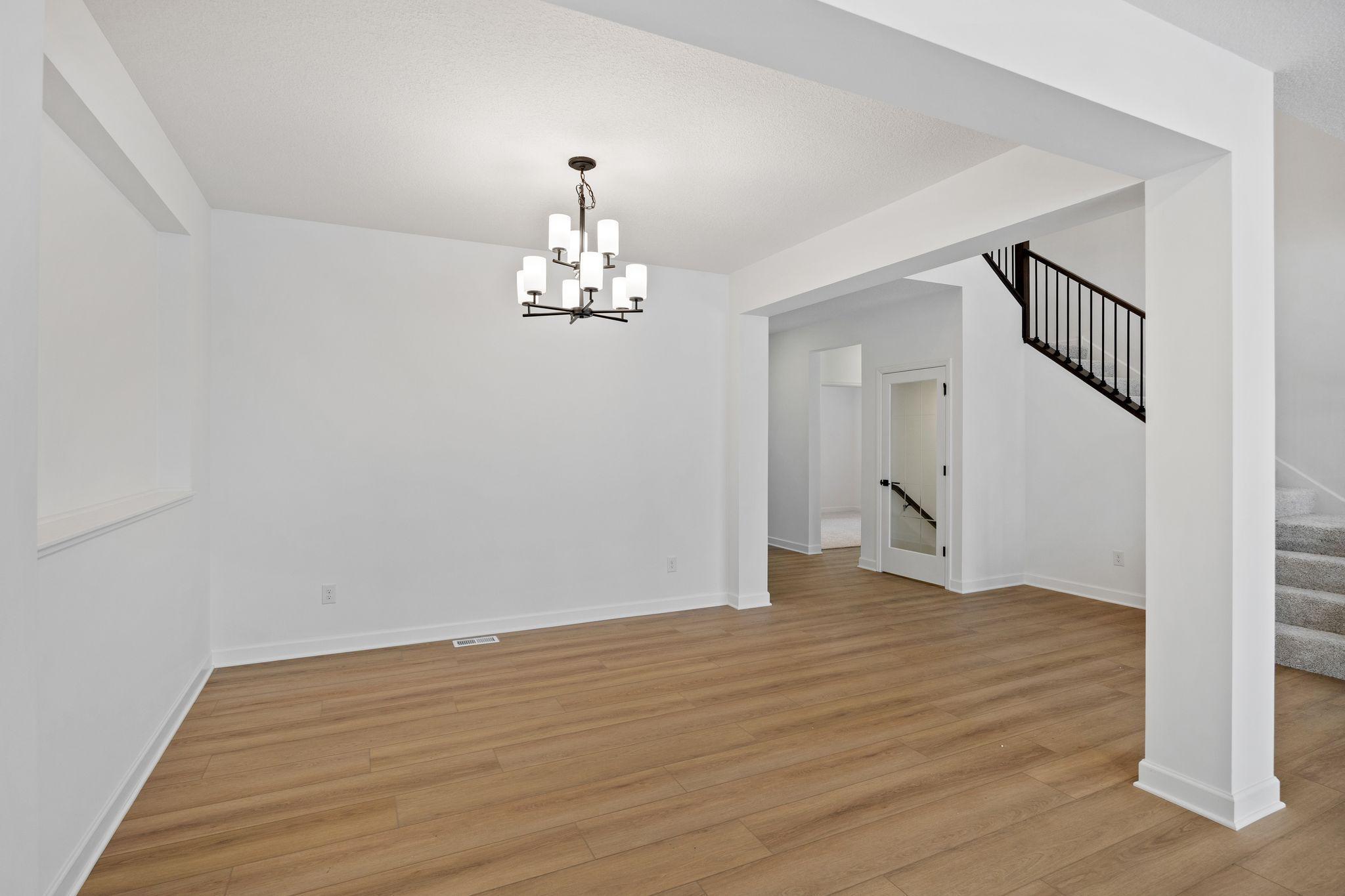 (Photo of a similar home, actual finishes may vary) The dining room is an elegant space designed for elaborate meals and celebrations with friends and family.