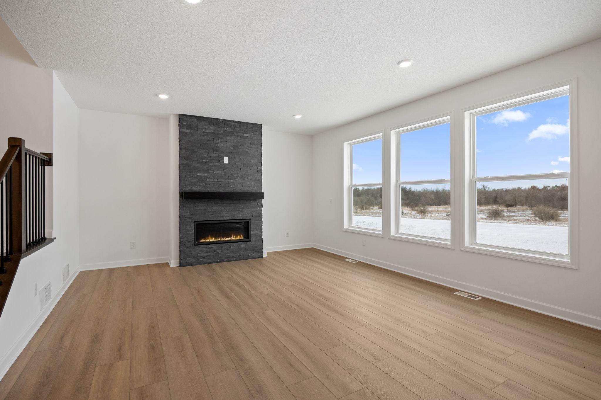 (Photo of a similar home, actual finishes may vary) The Great Room is the natural gathering space within the home, ready for seamless entertaining and relaxation throughout the week.