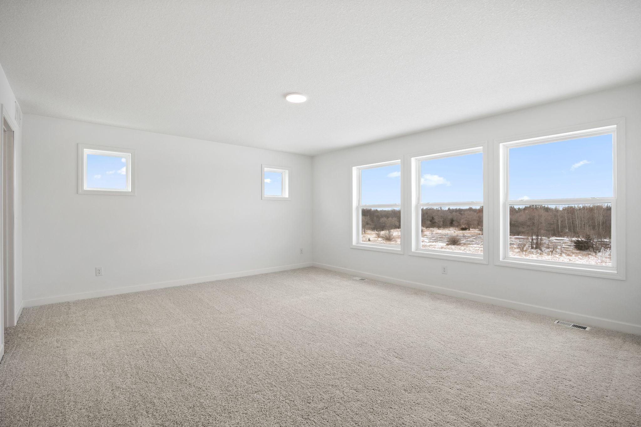 (Photo of a similar home, actual finishes may vary) Nestled into a private corner on the second floor, the owner’s suite is a restful retreat complete with a spacious bedroom, en-suite bathroom and generous walk-in closet.