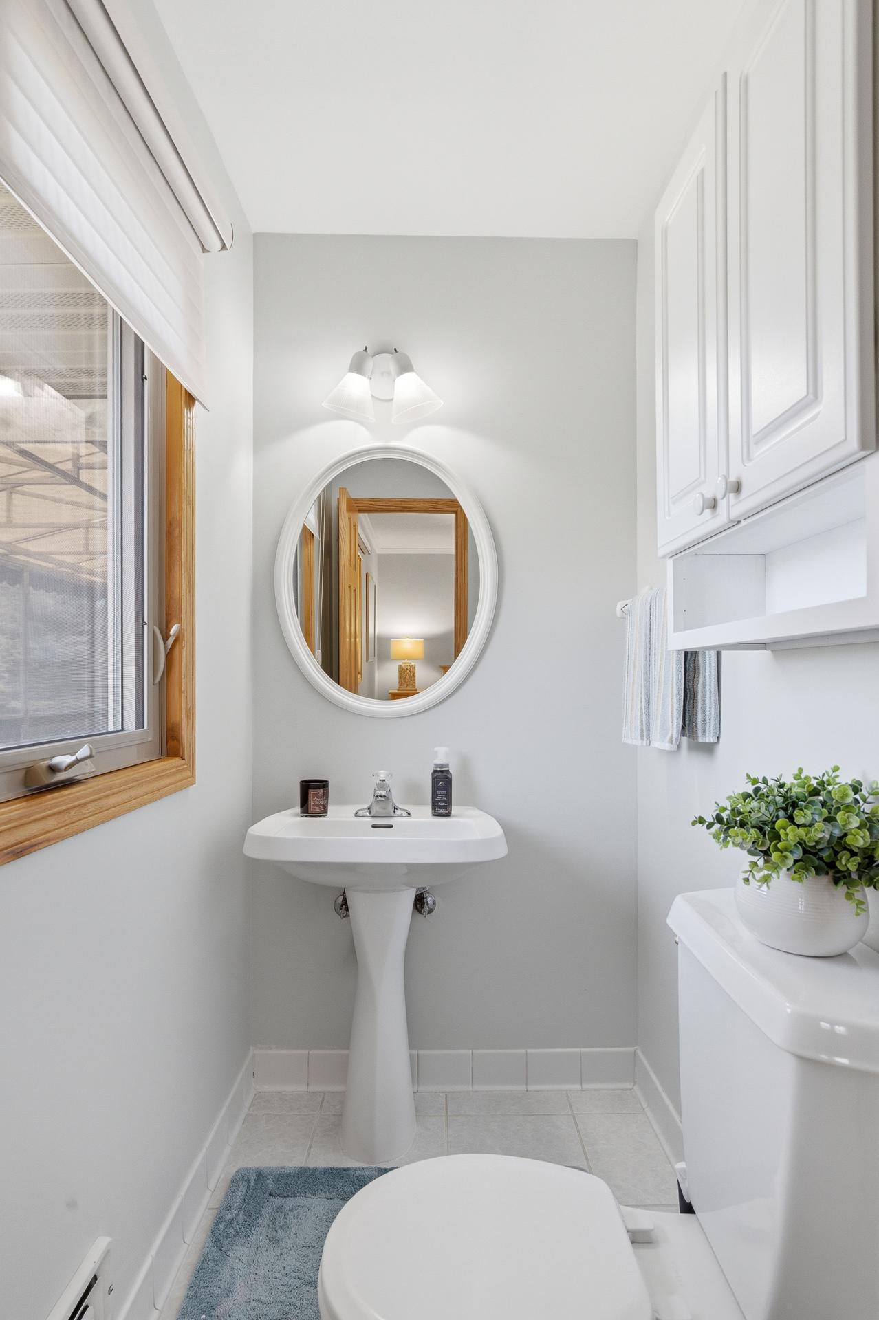 Primary Bedroom Half Bath with tile floor.