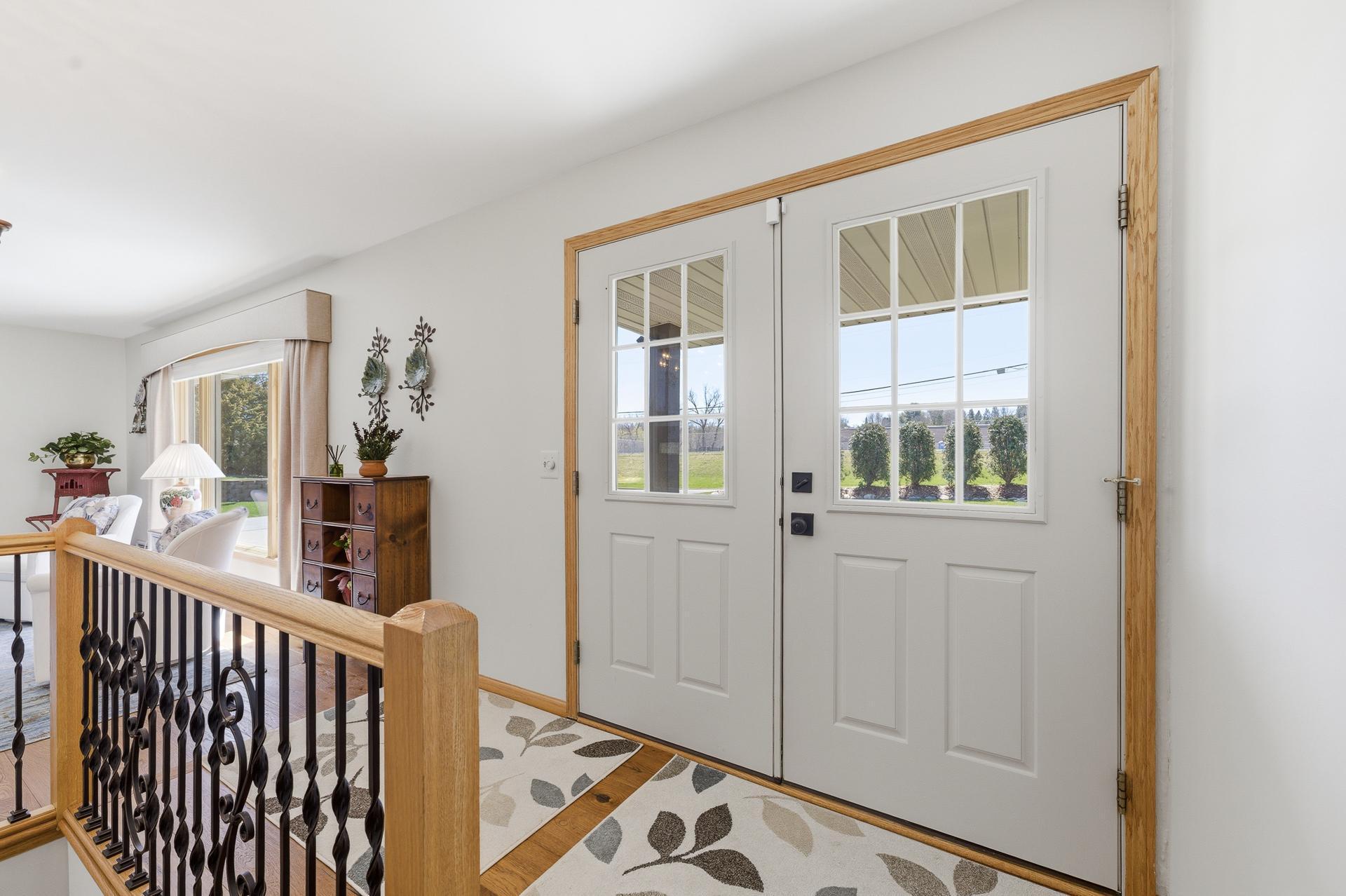 4x10 Foyer. South-facing double doors.