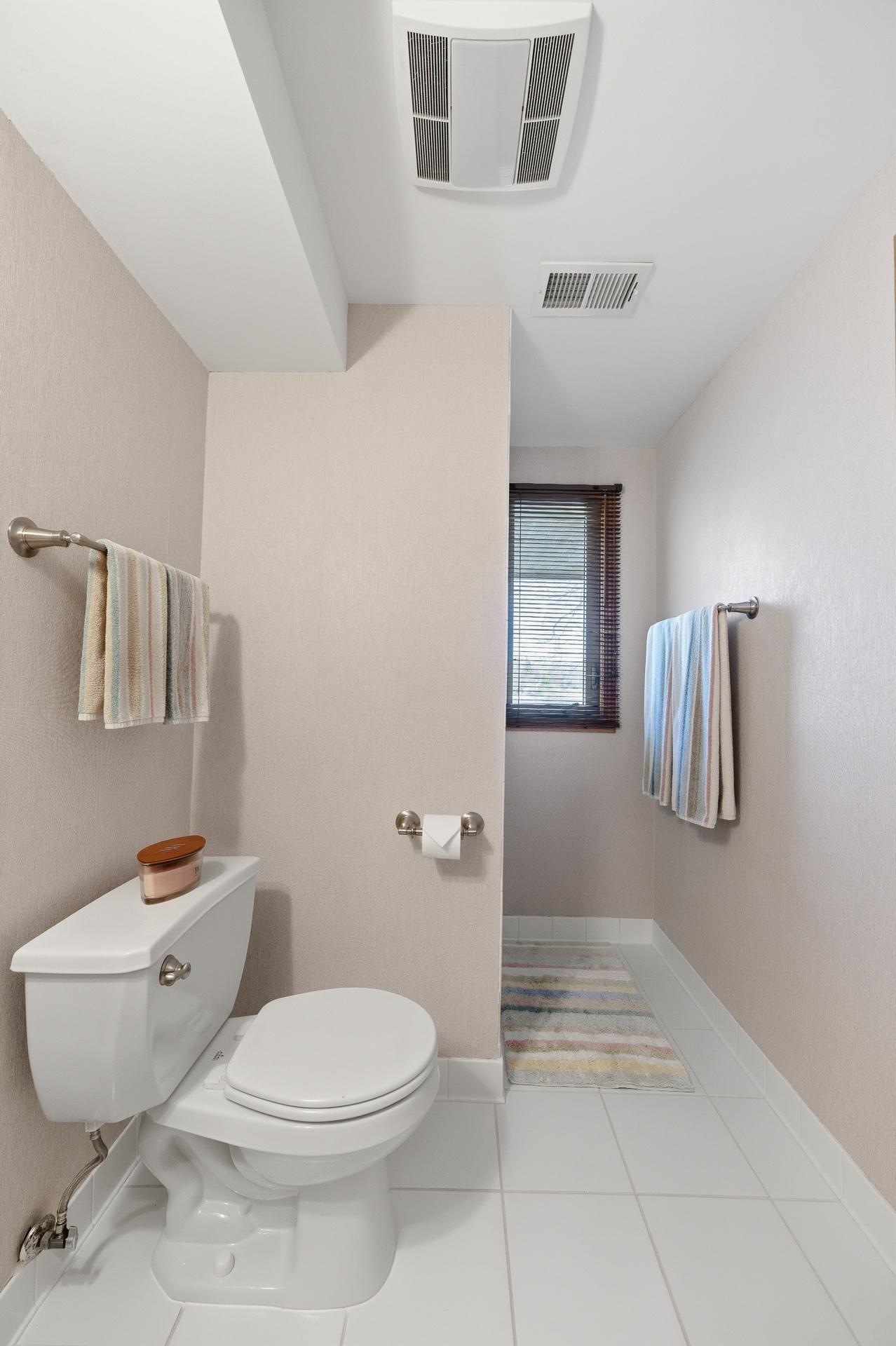 Lower level 3/4 bath with tile floor.