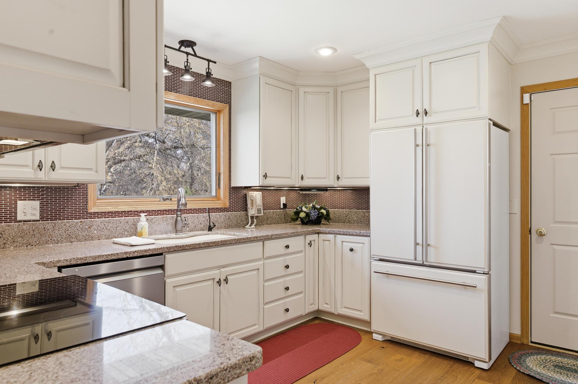 Renovated Kitchen with Cambria quartz countertops and 42" upper cabinets.
