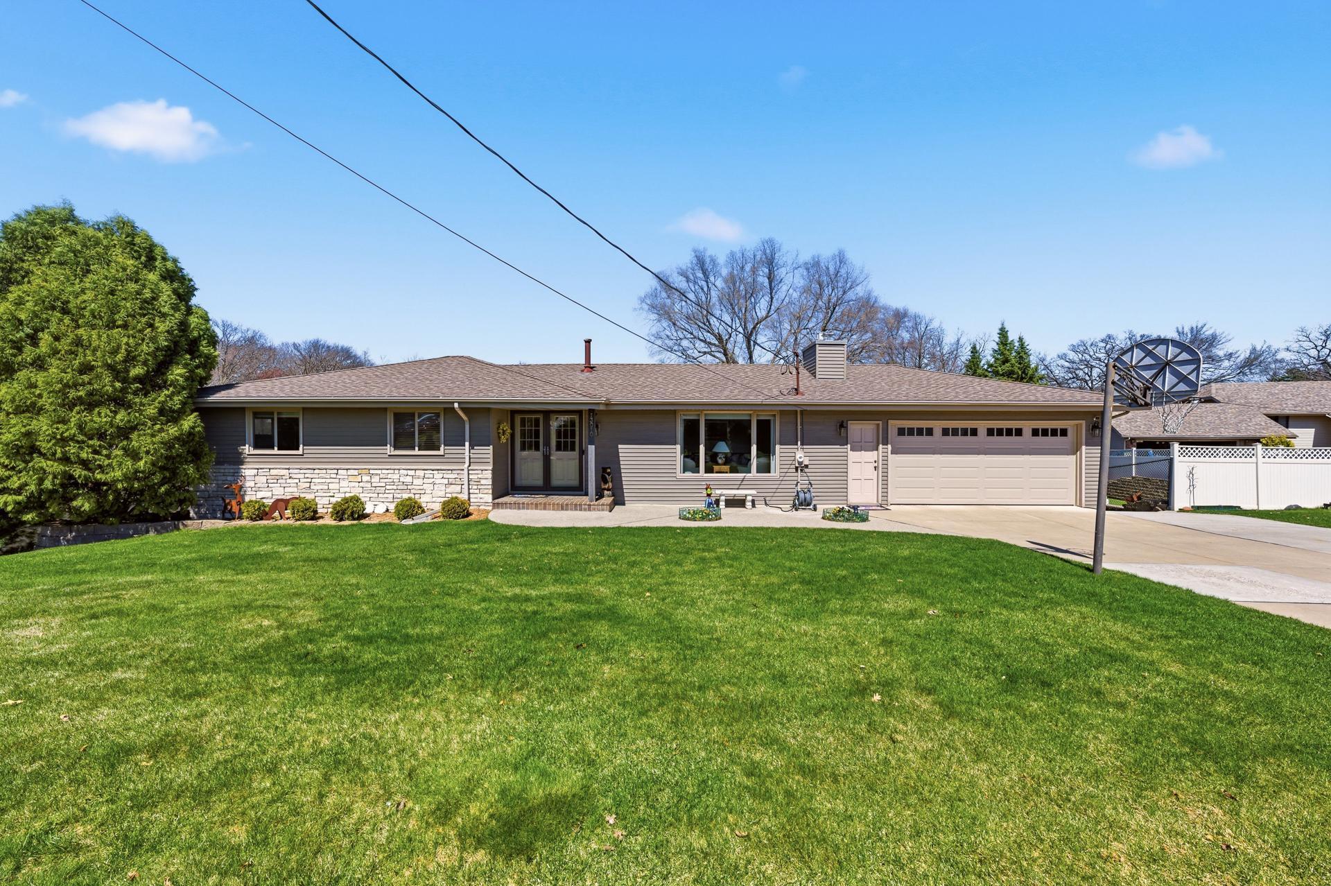 Maintenance-free exterior. New roof (2014). Thermotech windows (2013). Front steel siding & stone(2015), garage doors (2025). Concrete driveway.