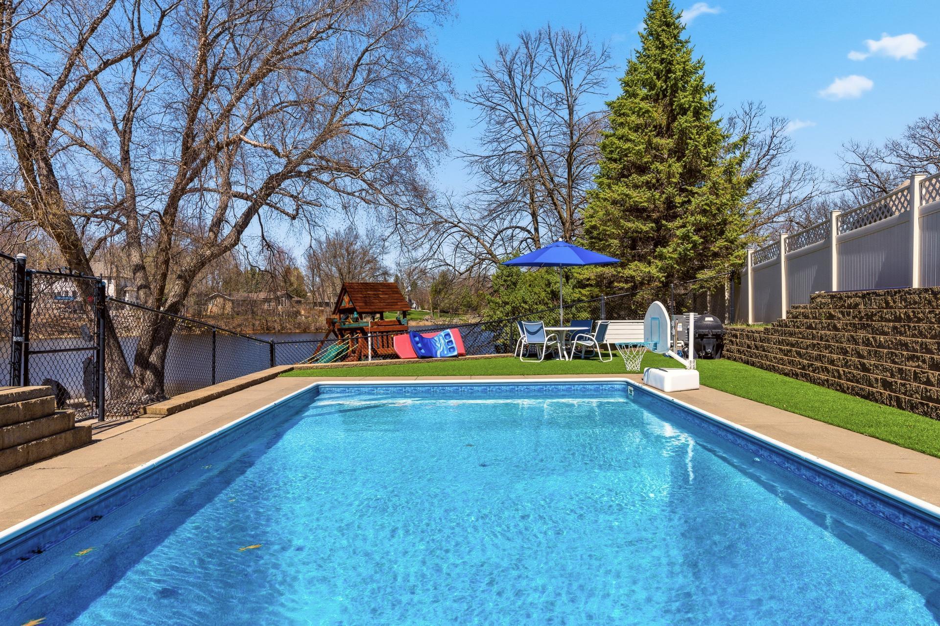 Fenced pool with newer liner.