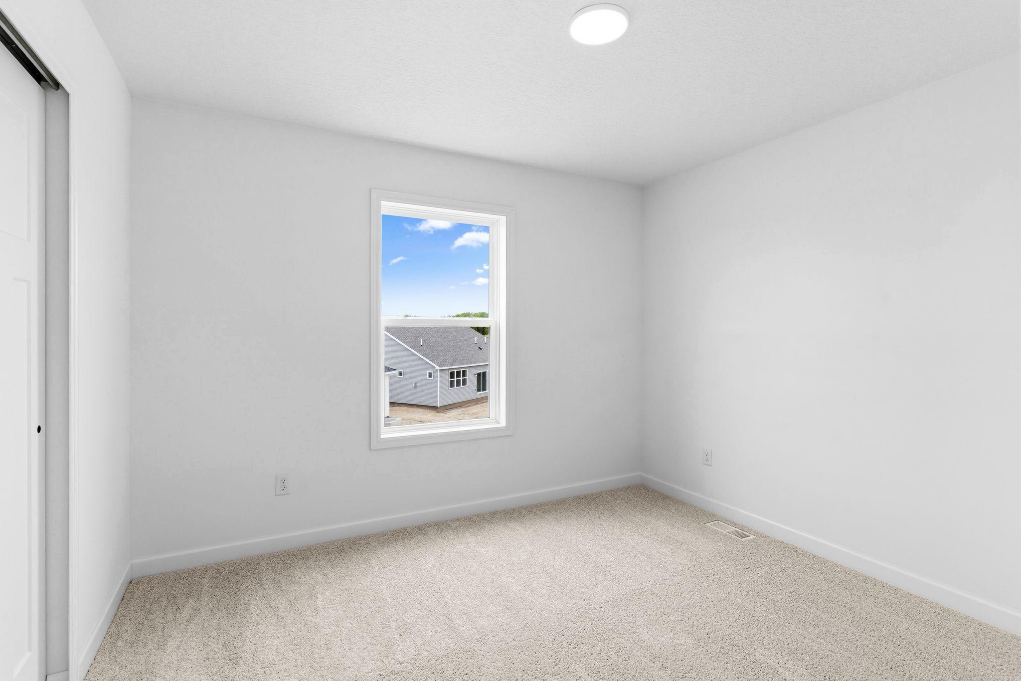 The secondary bedrooms are comfortable and private spaces.