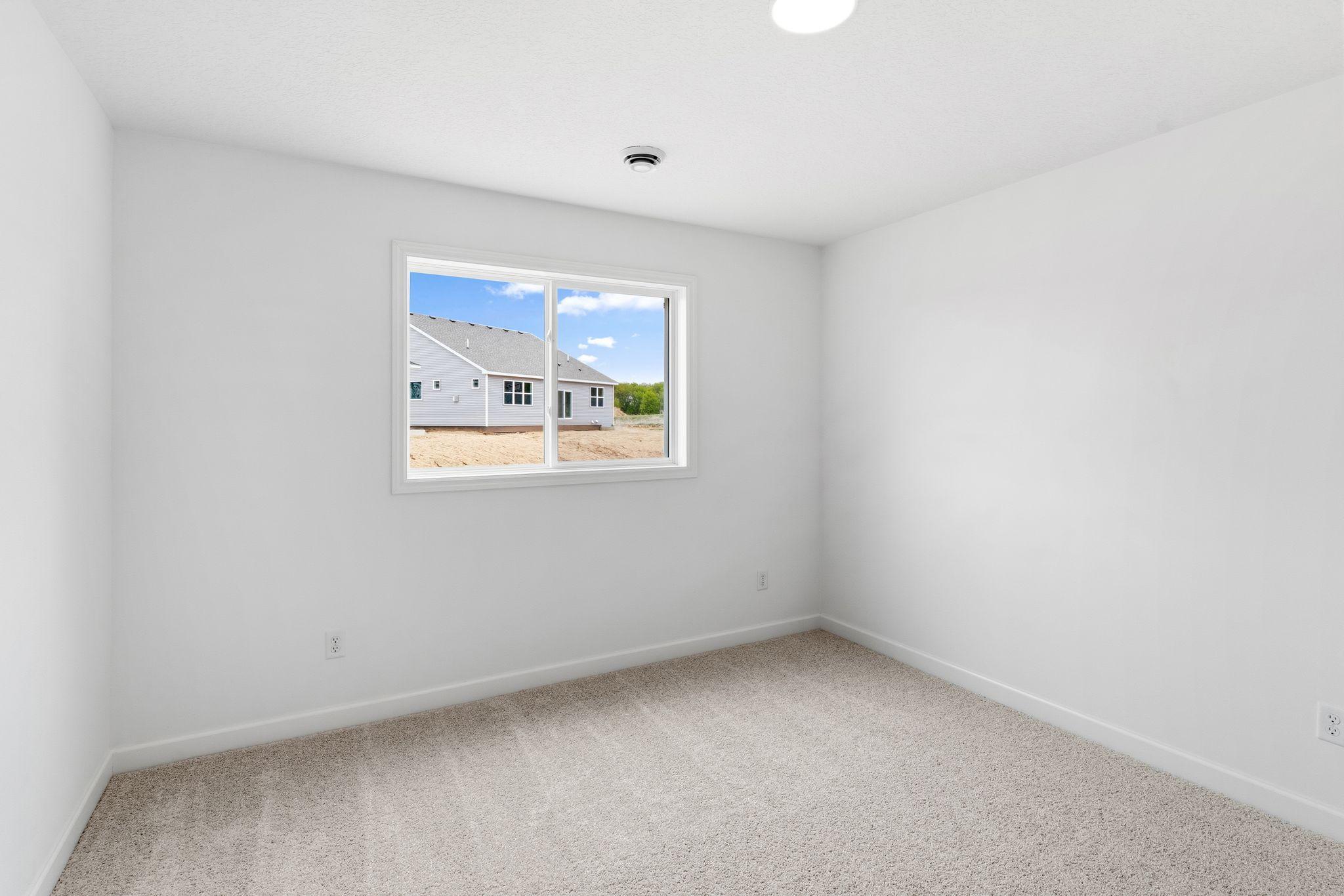 Three secondary bedrooms are found upstairs, down the hall from the owner’s suite.