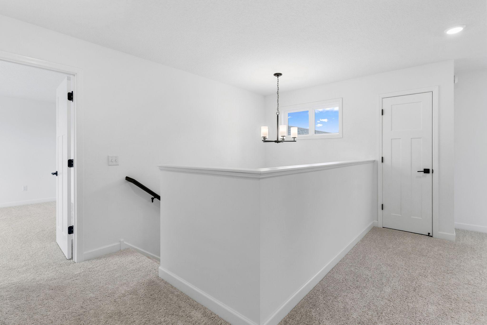 The upstairs landing provides ease of access to all upper level bedrooms