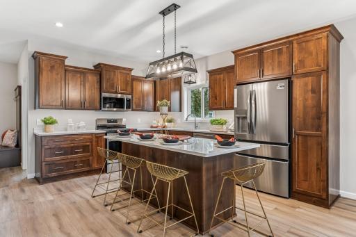 Open Design - stunning kitchen with custom, soft close cabinets, quarts center island, walk-in pantry and more!