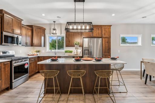 Open Design - stunning kitchen with custom, soft close cabinets, quarts center island, walk-in pantry and more!