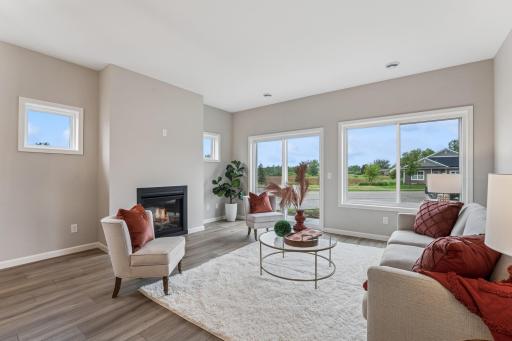 Great living room with tons of natural light and sliders to patio. The optional fireplace can be customized to stay sleek or add mantel and stone surround.